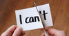 Hand cutting piece of paper 