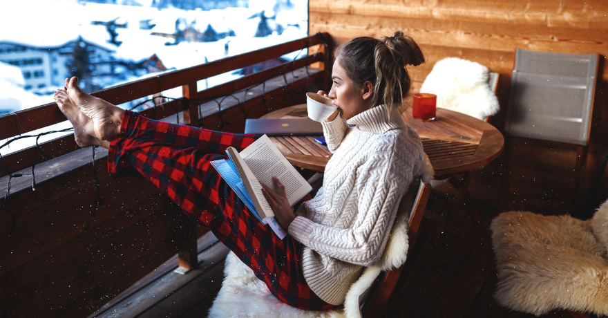 woman sitting drinking tea in winter