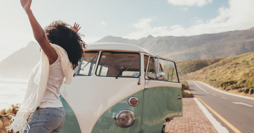 Woman in front of van on the road